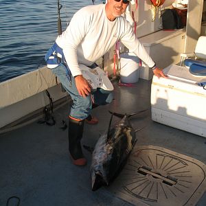 Brother & bluefin.  Brother is the one with the hat on.