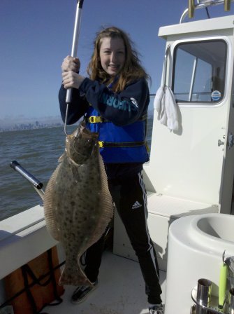 My daughter, Jackie, with her first halibut. 5.9.10