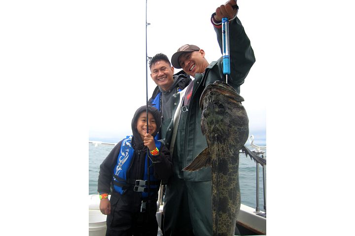 Three Generations, Two Fish on one Line, One Lucky kid. Lucky 15lb Ling released.