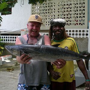 Jamaica fishing no poles (hand lines) king fish is what we cought. ( rasta mon) in the pic and me.