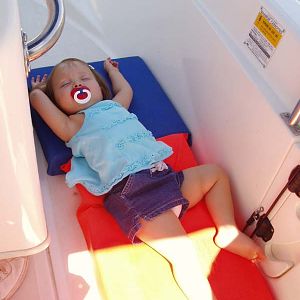 Katie sleeping on the boat as a toddler.