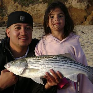 My daughter and I catching Stripers at Montara 7/8/09