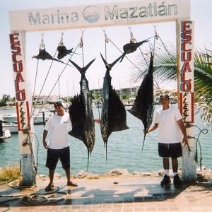 Our catch of the day. My brother and I in Mazatlan. August 2003 on Vikings Fleet.