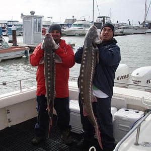 My buddy Roq and myself with two nice sturgeon!