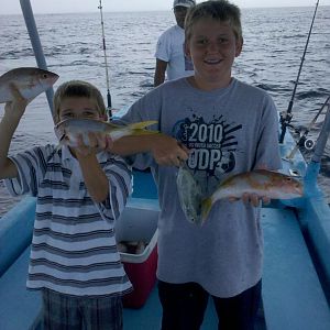 Both kids have caught fish more than they weigh, yet they decide to fish mexican style for yellowtail snapper... HANDLINING.