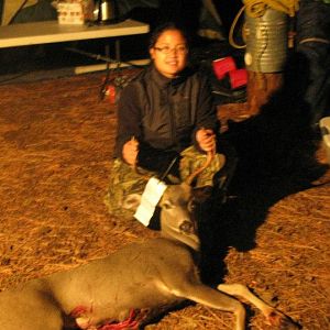 Steph's first picture with a buck, first time at deer camp.
