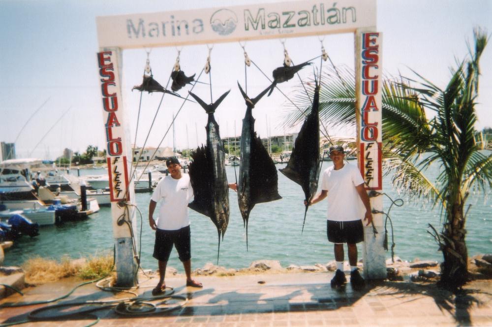 Our catch of the day. My brother and I in Mazatlan. August 2003 on Vikings Fleet.